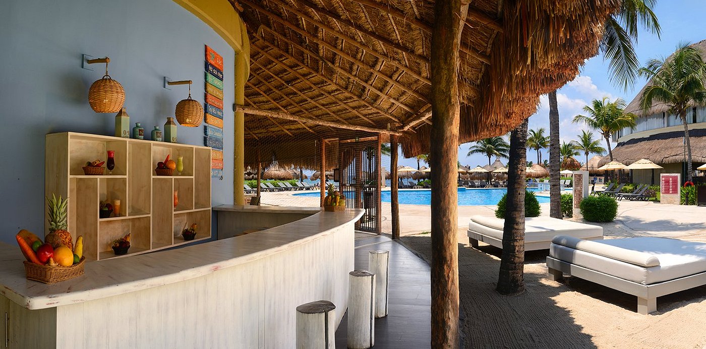 Poolside cabana bar with thatched roof